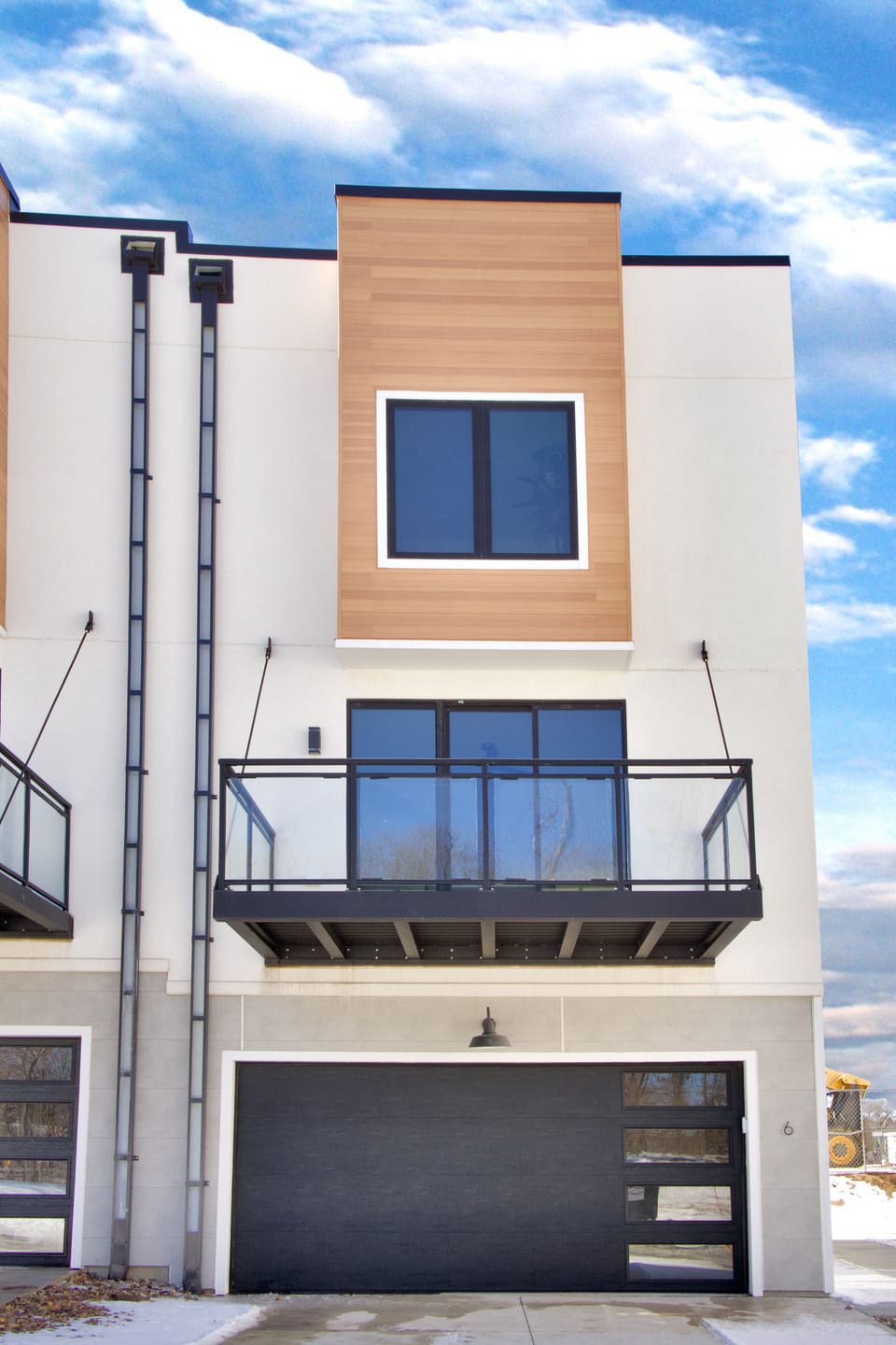 End unit makes for easy access in and up; main door & side parking to right.