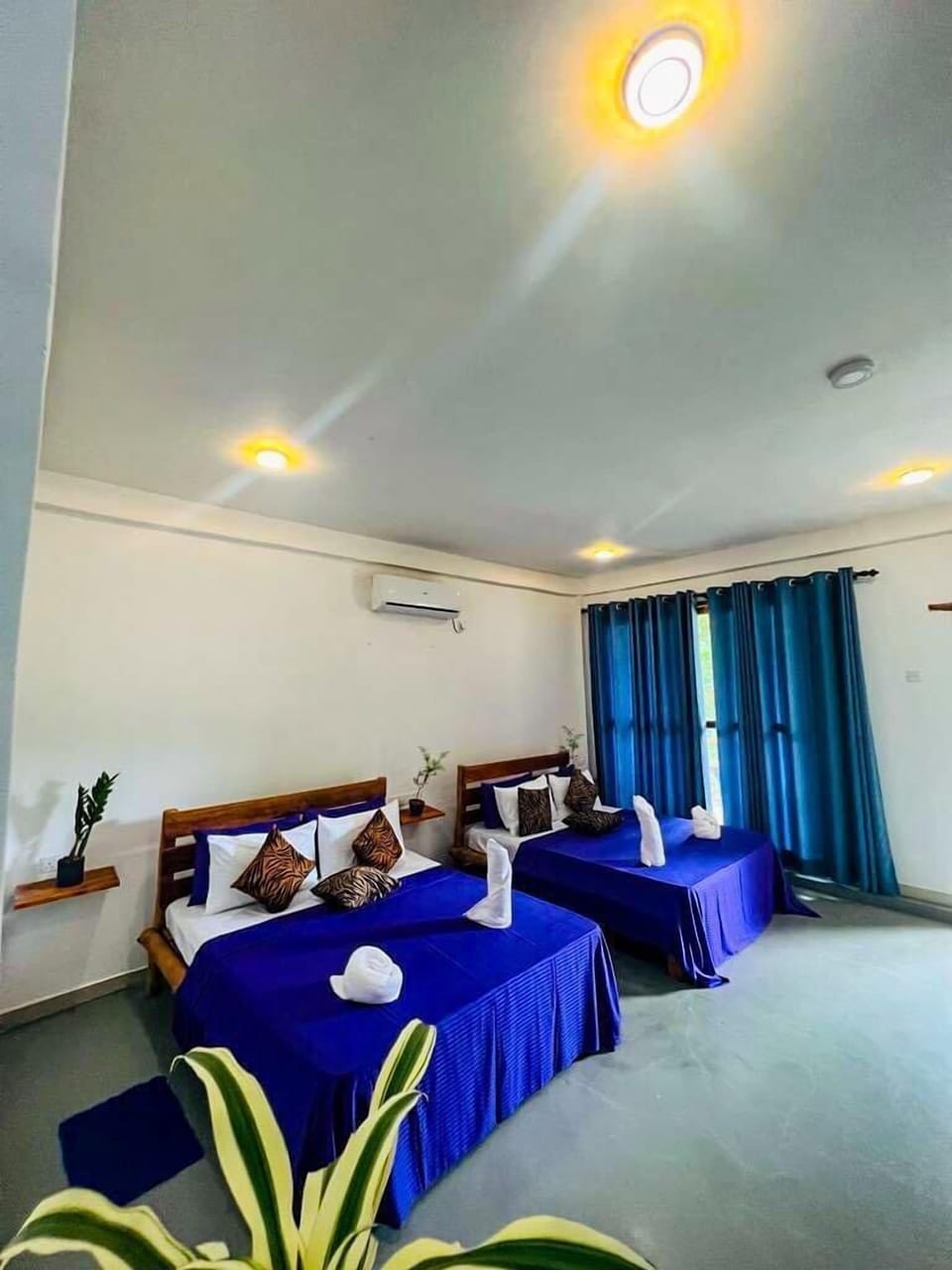 Deluxe Quadruple Room | Desk, iron/ironing board