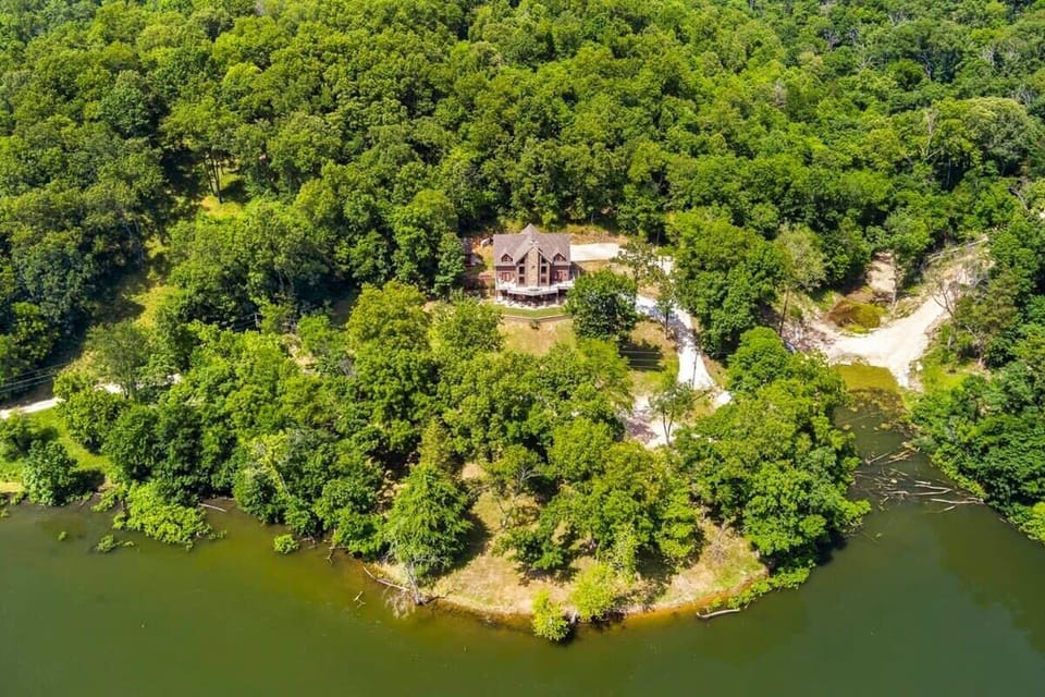 Aerial view of our secluded retreat along the tributary—lush greenery and tranquil cove