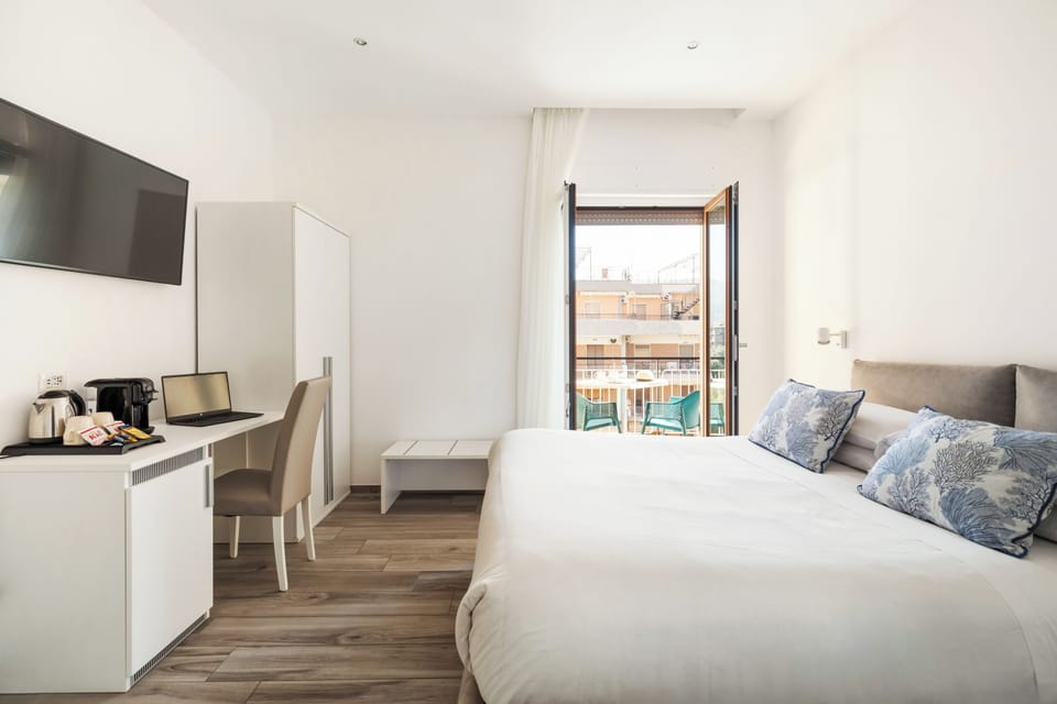Deluxe Room, Balcony | Minibar, in-room safe, desk, free WiFi