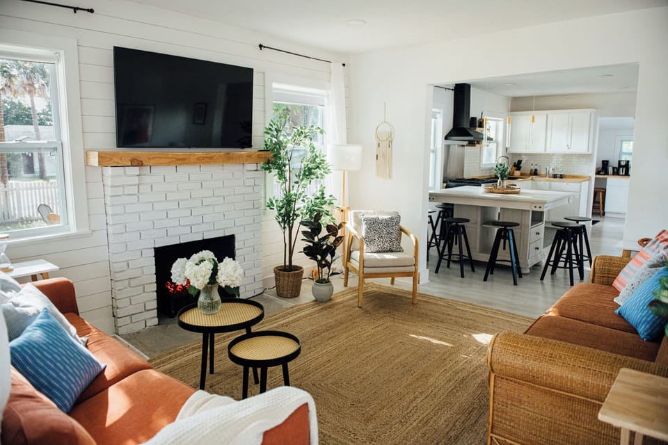 The open-concept layout offers a seamless flow between the living area,  kitchen and dining area. 