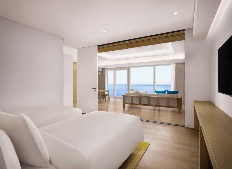 Suite, 1 Bedroom, Partial Sea View (2 Twin Beds) | In-room safe, laptop workspace, free cribs/infant beds, free WiFi