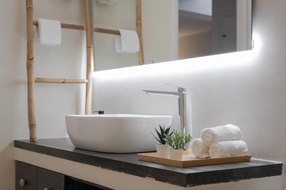 Family Villa | Bathroom | Rainfall showerhead, eco-friendly toiletries, hair dryer, towels
