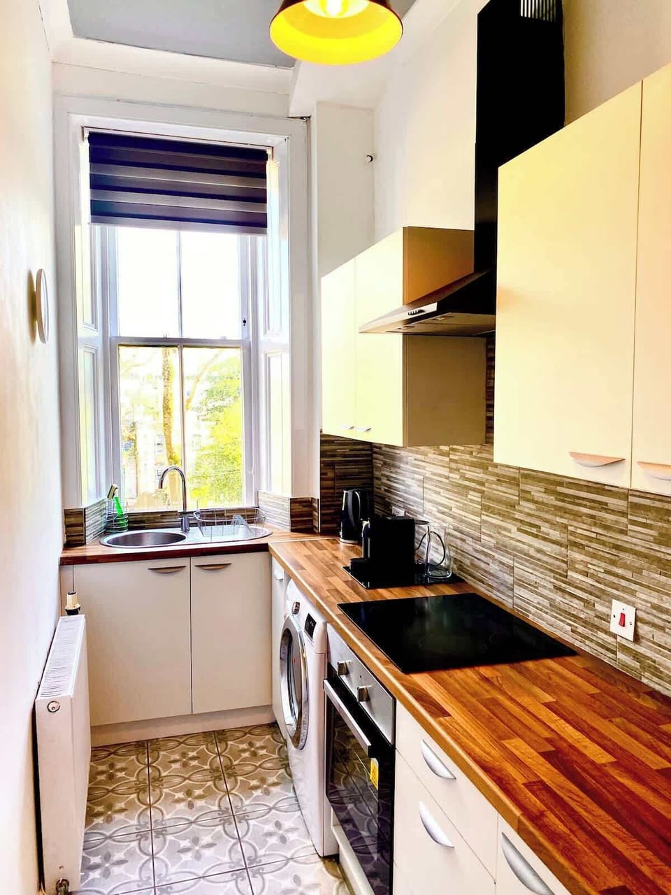 Fully equipped kitchen with essential appliances and utensils. Perfect for preparing home-cooked meals during your stay.