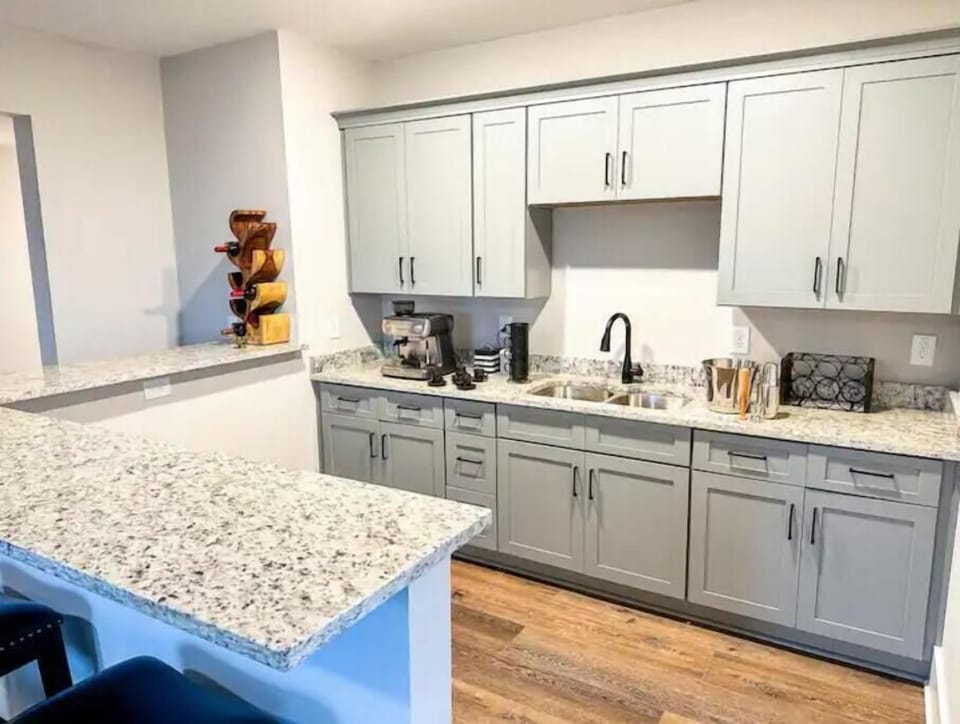 Kitchenette with espresso machine and bar seating