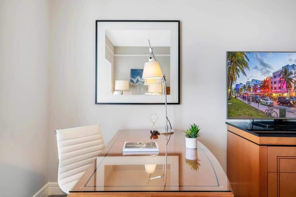 Wake Up to Paradise: Experience Ultimate Comfort in Our Bedroom Suite, Featuring a Majestic Ocean View, Plush King Bed, Smart TV, Ensuite Bath, and Work Desk.