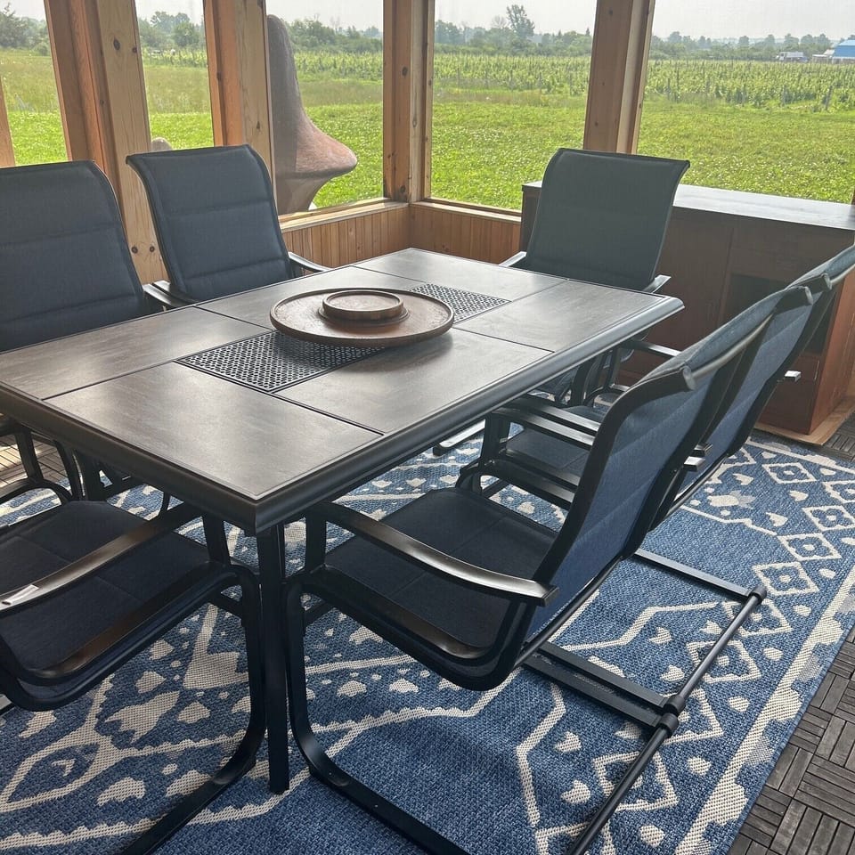 Screened porch dining.