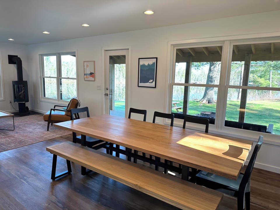 Hand built oak and walnut table becomes the centerpiece of every group dinner