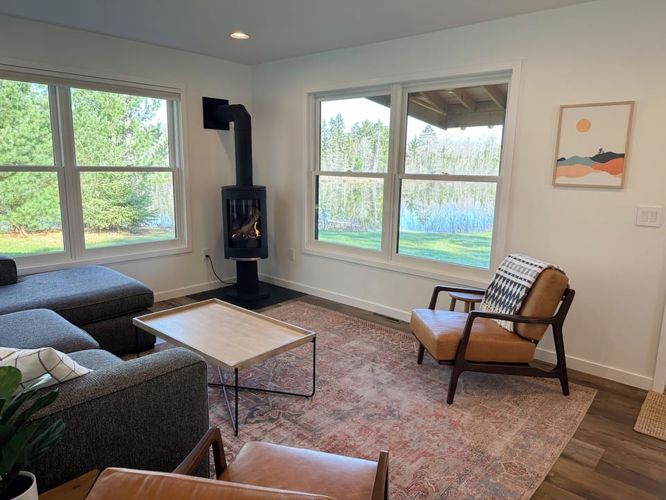 The Norwegian Jotul stove provides comfort and warmth in this tranquil space 
