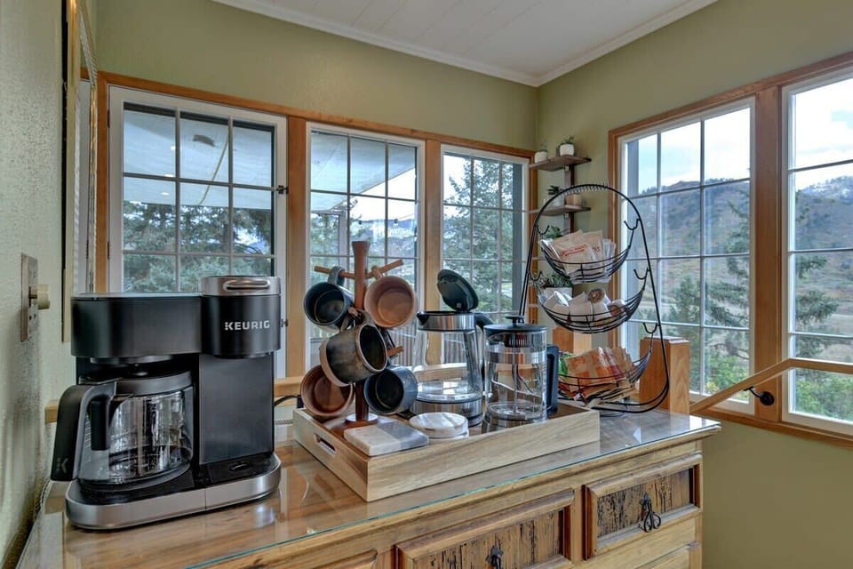 Coffee station including a Keurig Duo, Electric Kettle, French press, k-cups and loose ground coffee, tea assortment, treats and snacks. 