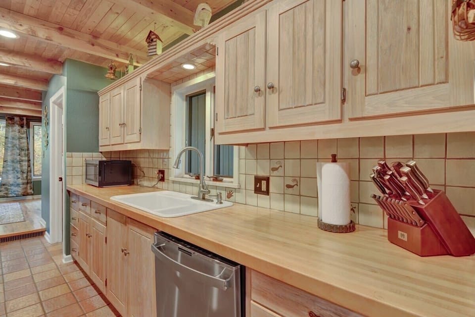 Well stocked kitchen with high end appliances and abundant natural light 