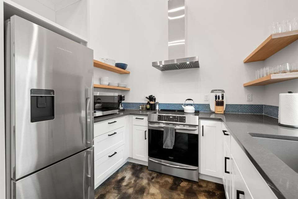 Fully equipped kitchen with coffee bar.