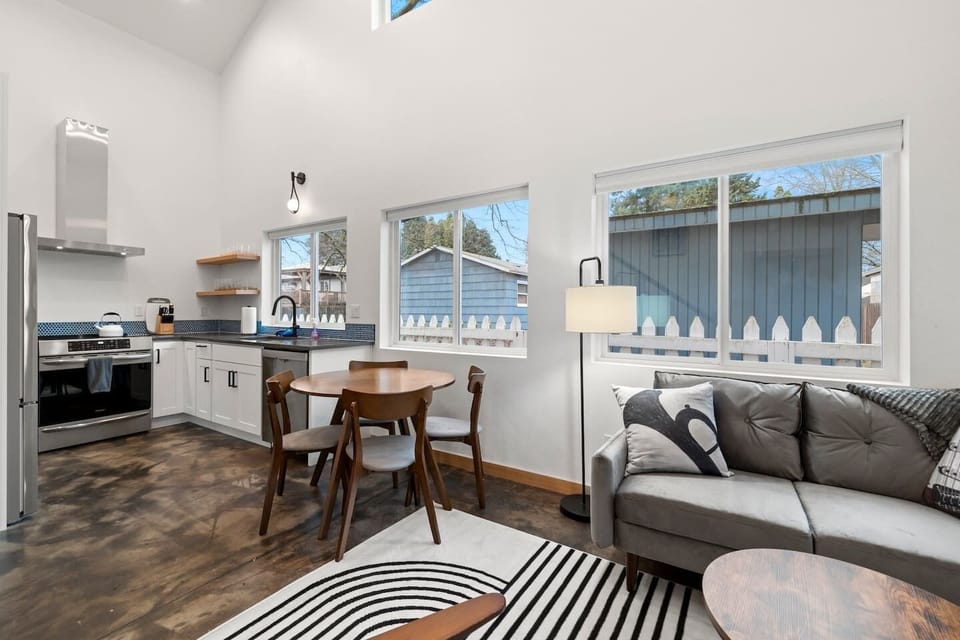 Dining and Lounge Area: Bright and inviting space with modern decor and ample windows for natural light!