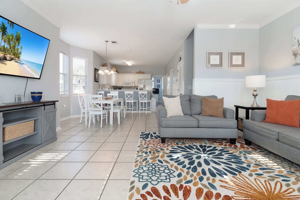 Enjoy the large Smart TV and comfy seating in the living room.