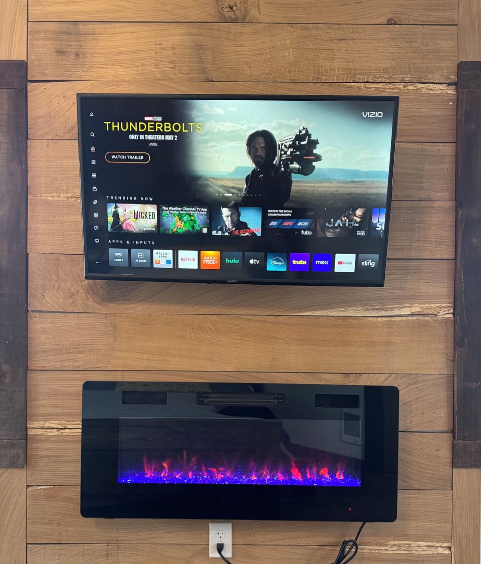 Smart TV and electric fireplace in lower master bedroom!