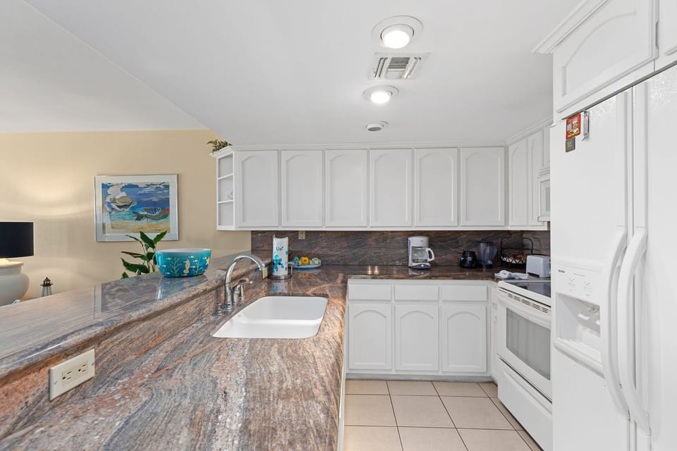 Fully equipped kitchen area with granite counter tops!