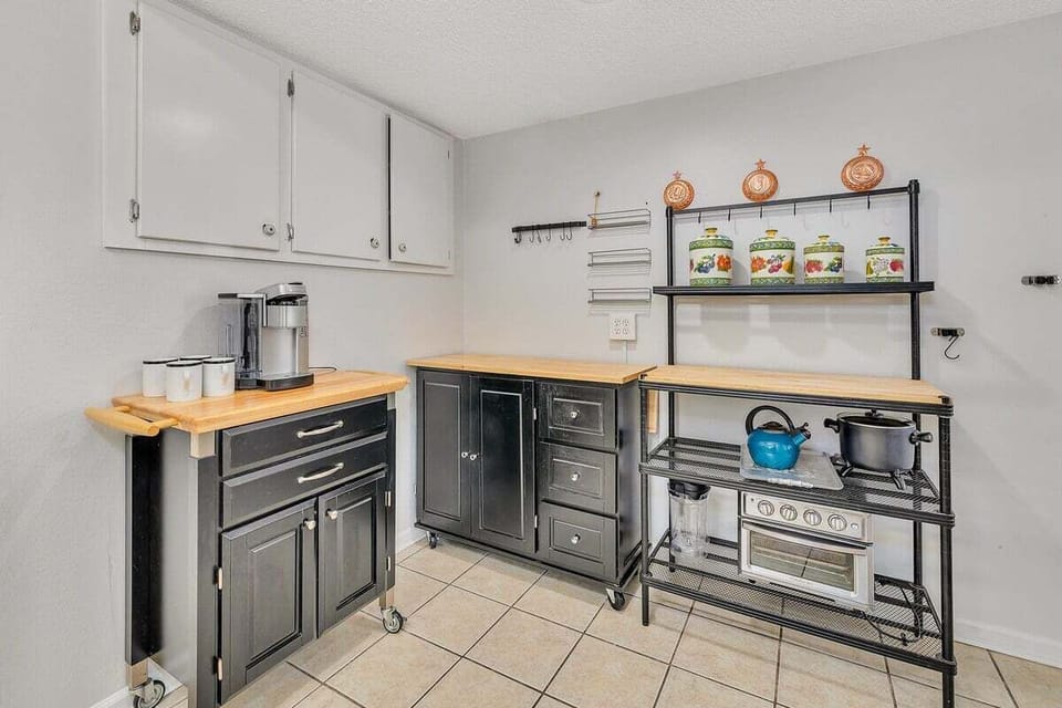 Kitchen cart with butcher block top and open shelving