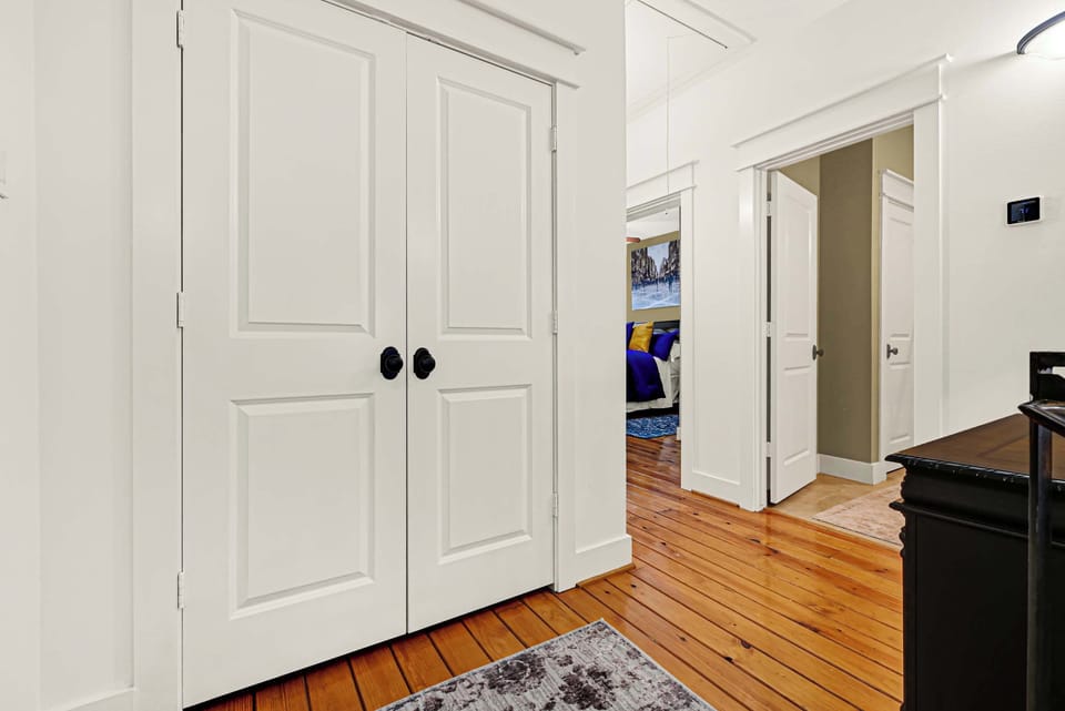 Upstairs hallway with closets and access to additional bedrooms.
