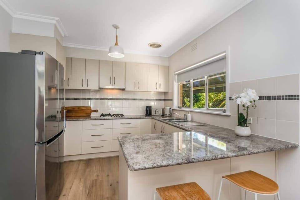 Fully-equipped kitchen with all the amenities you need for a comfortable stay. 