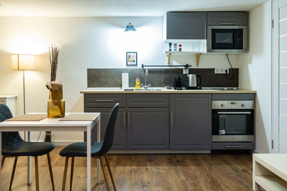 Comfort Apartment | Private kitchen | Mini-fridge, microwave, oven, stovetop