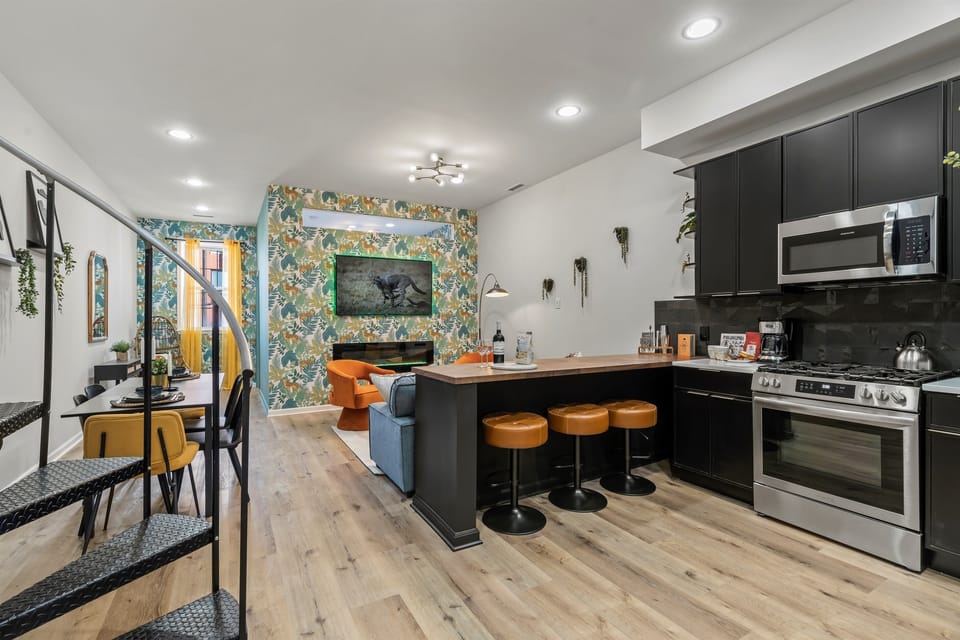 The heart of the home, where conversation flows from the kitchen to the living room.
