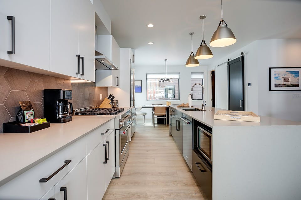 Your modern chef's kitchen awaits with sleek countertops, premium appliances, and stylish pendant lighting for memorable meals.