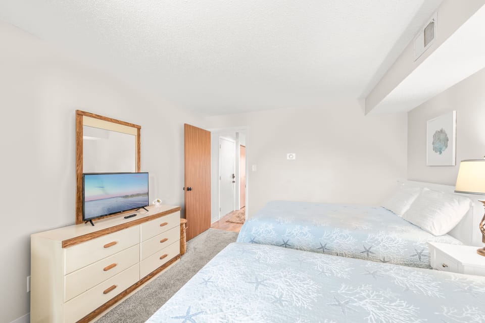 Sink into bed and relax while watching your favorite movie on the Flat Screen TV.