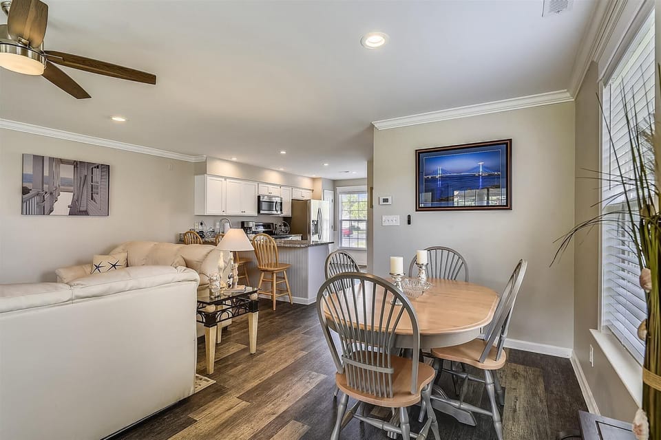 Gather around your cozy dining table after a day of exploring, with a bright kitchen ready for home-cooked meals and a living space designed for relaxation.
