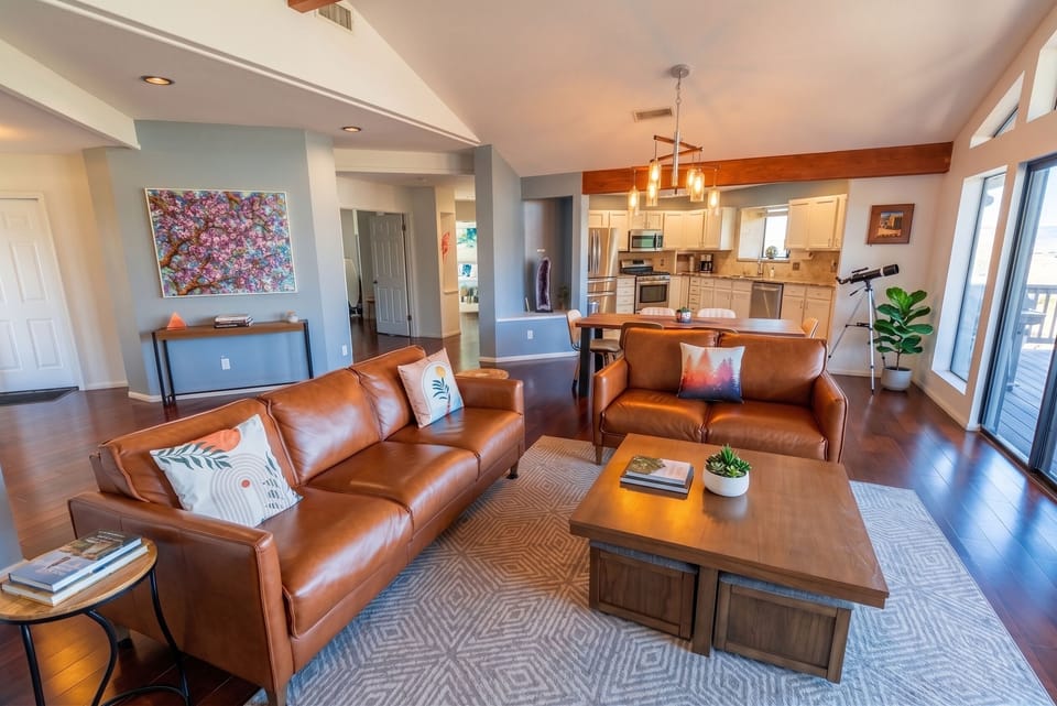 Open-concept living room with comfortable leather sofas