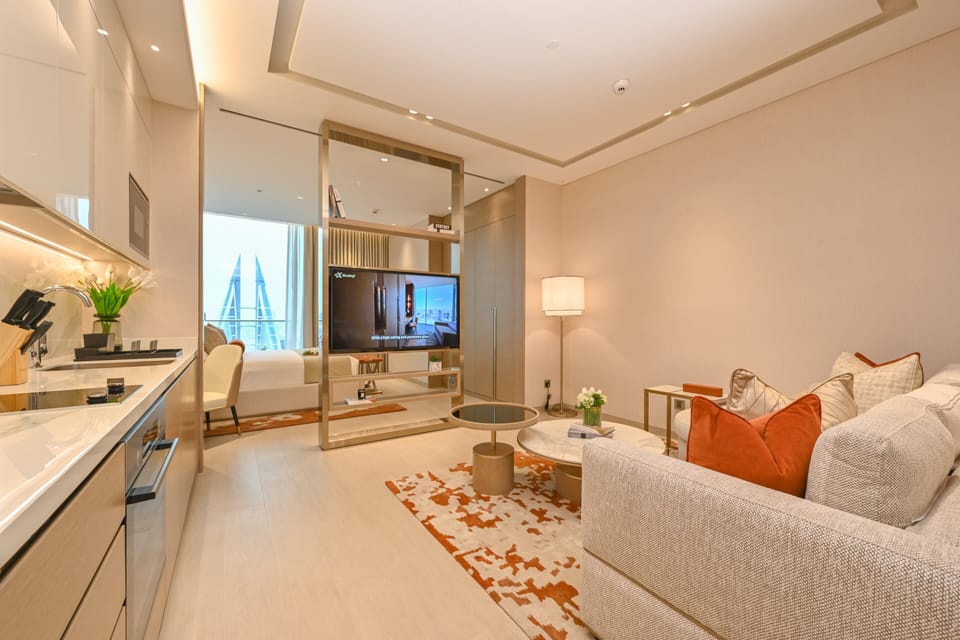 Panoramic Suite, 1 King Bed, Bay View | Living room | 55-inch LED TV with satellite channels