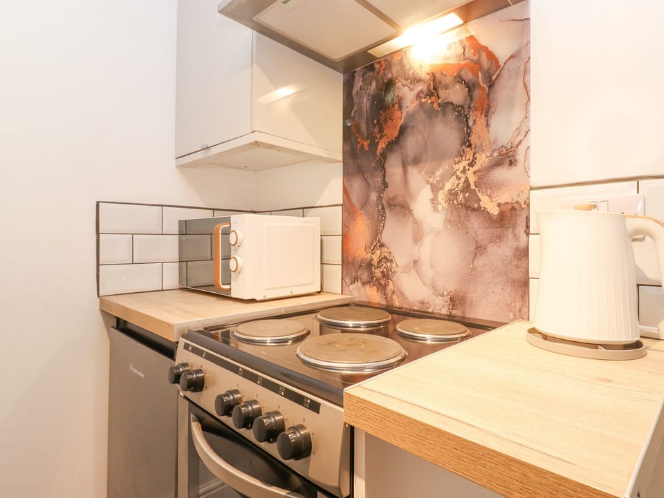 Fridge, electric kettle, toaster, cookware/dishes/utensils