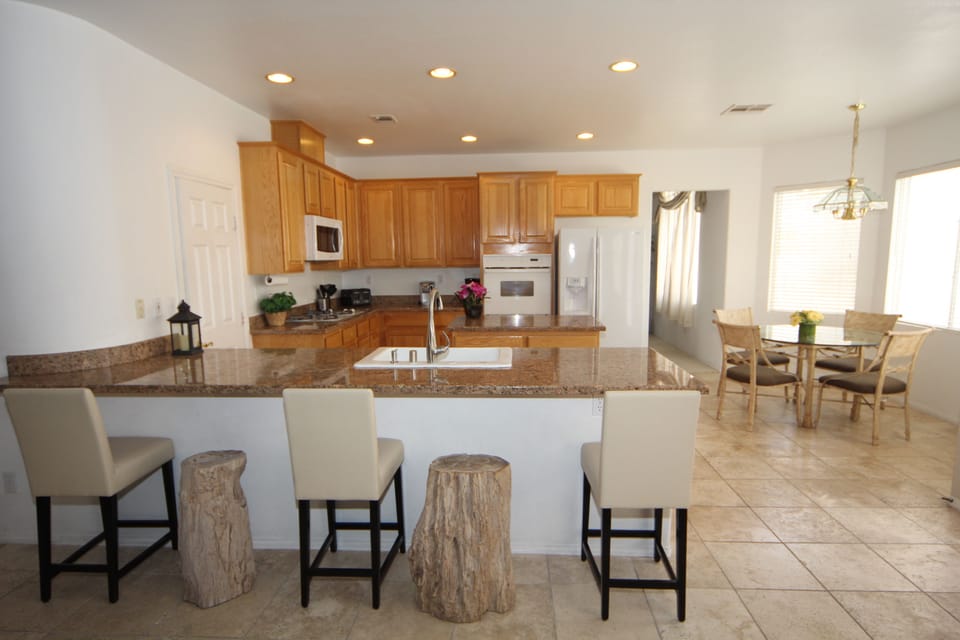 Kitchen, Bar Seating w/Petrified Wood Stools and Regular Seats