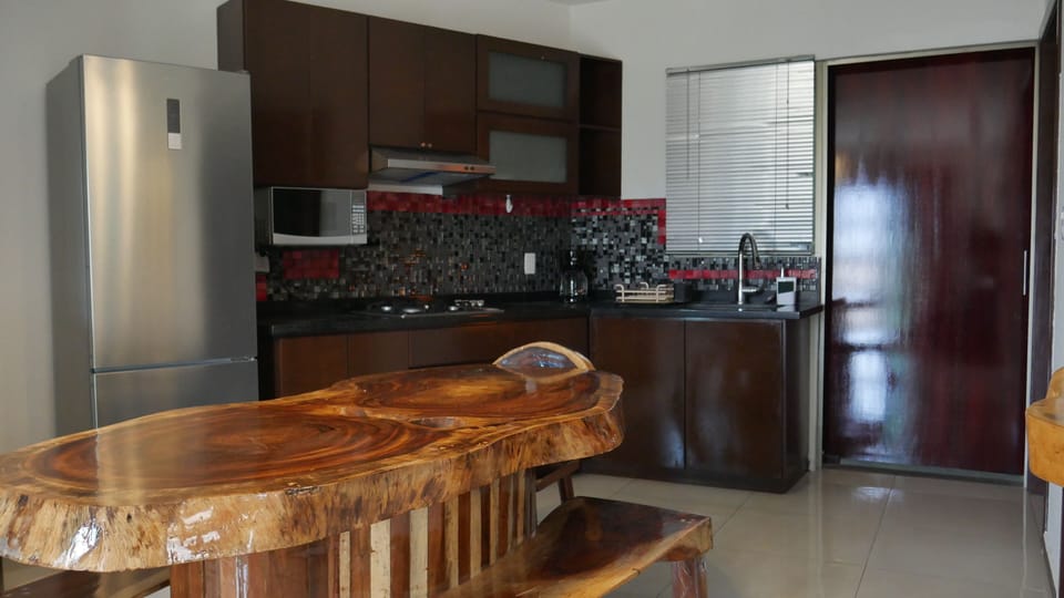 Executive Apartment | Private kitchen | Full-size fridge, microwave, espresso maker, coffee/tea maker
