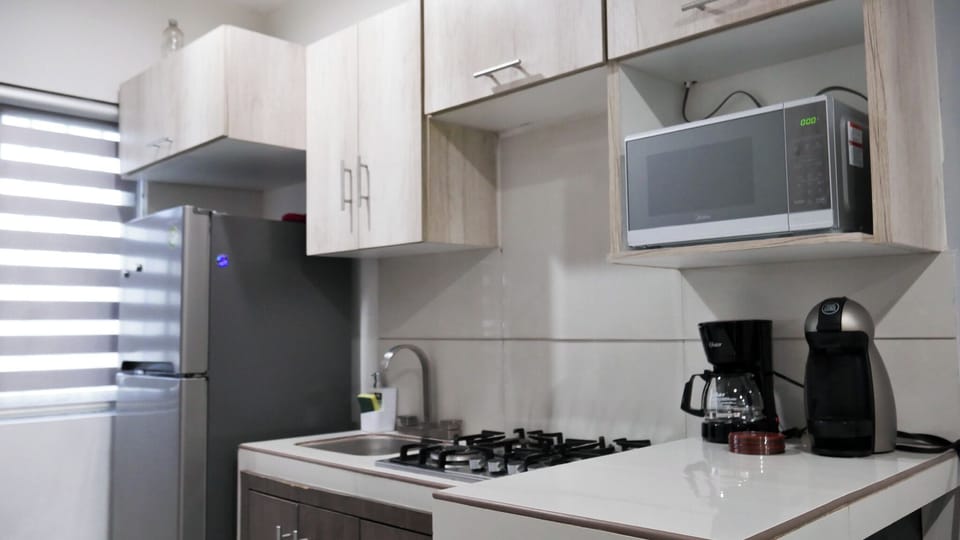 Family Apartment, 3 Bedrooms | Private kitchen | Full-size fridge, microwave, espresso maker, coffee/tea maker