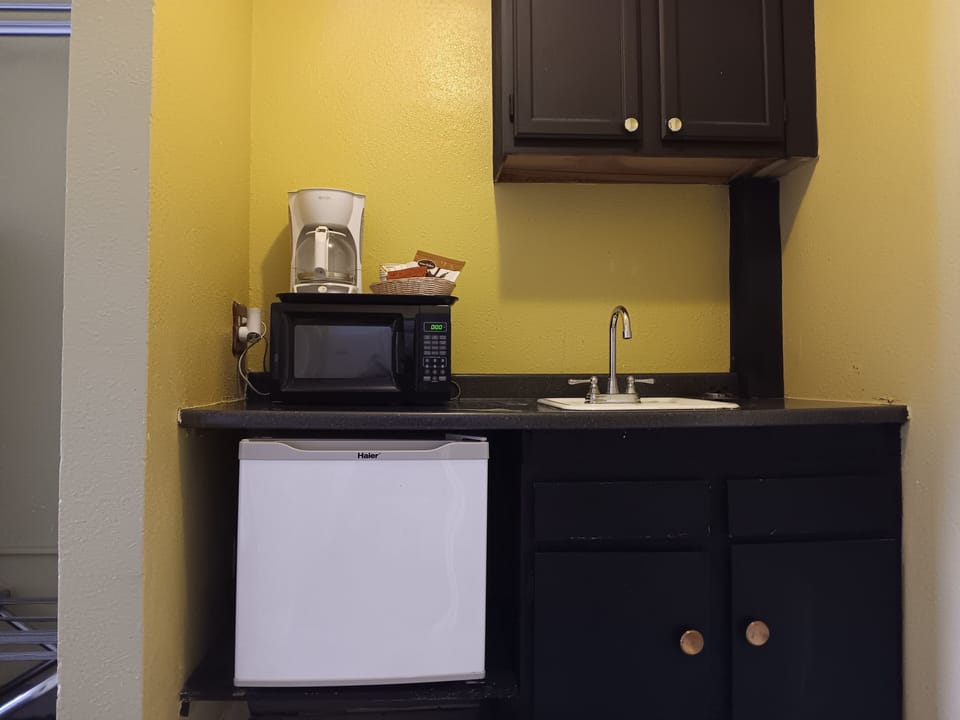 Standard Double Room Single Use, 2 Queen Beds | Private kitchen | Fridge, microwave, coffee/tea maker