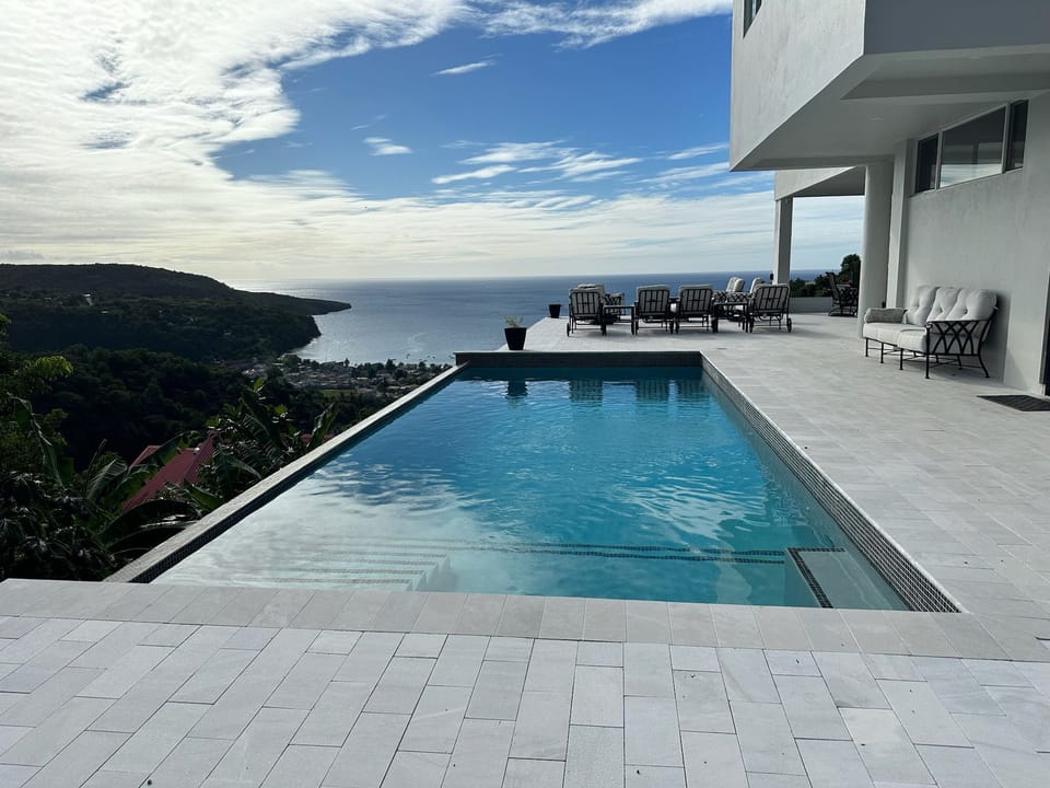 Blue Waters Pool with Sea and Mountain View (2)