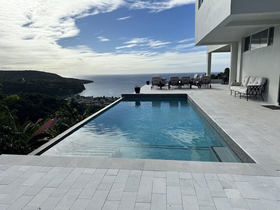 Blue Waters Pool with Sea and Mountain View