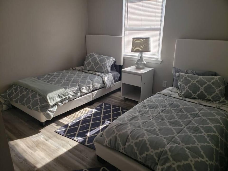 Second bedroom with two twin beds and comfy bedding