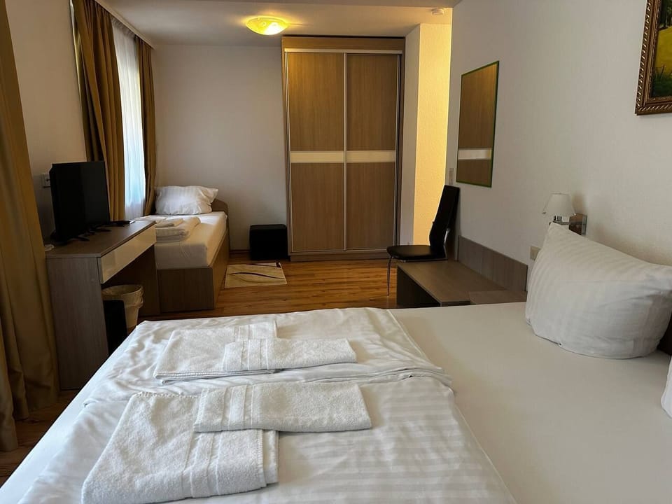 Desk, laptop workspace, free WiFi, bed sheets