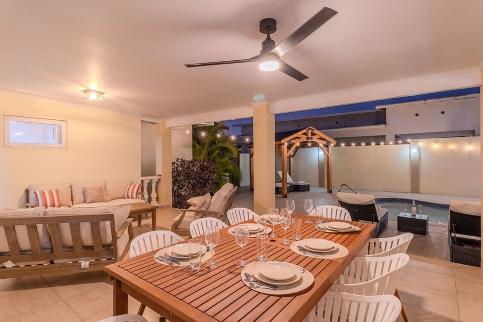 Savor the delights of dining under the stars at Opal Breeze`s outdoor dining area, where the night sky sets the stage for unforgettable culinary experiences.