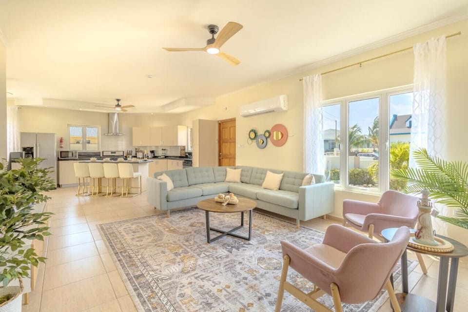 Bright and spacious living area with an open kitchen.