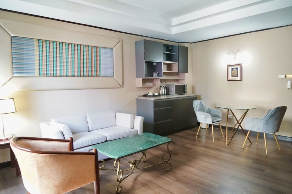 Junior Double or Twin Room | Living area | 32-inch flat-screen TV with cable channels, TV