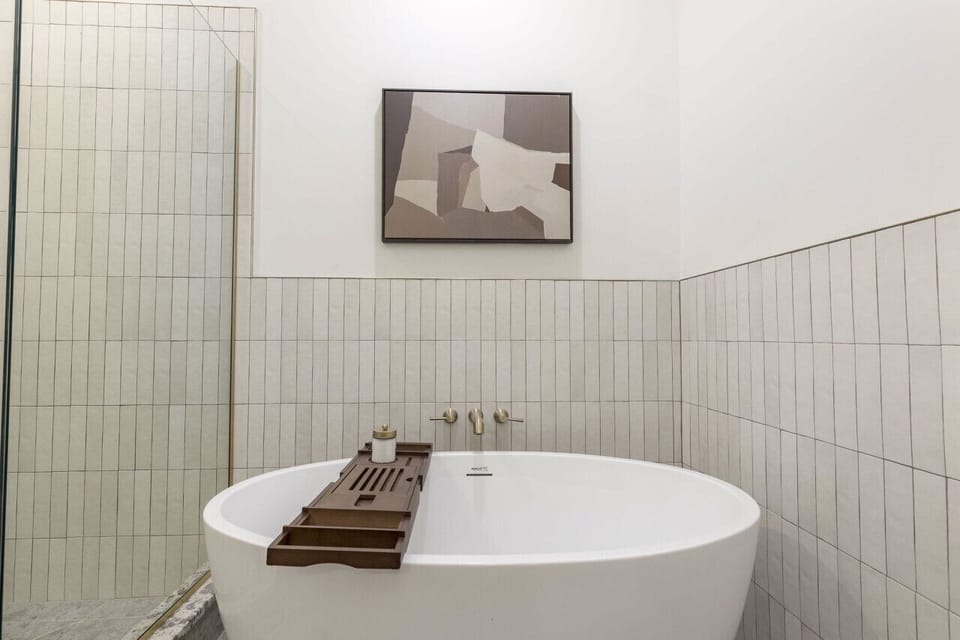 Bathroom 1. Soak and savor with Hollyhock custom shampoo and body wash. Towels are of course, provided. So are bath salts!
