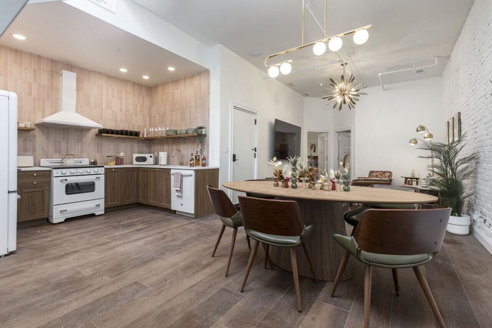 Step back in time to mid-century grandeur. This suite takes you back. Custom kitchen, record player, 85` Smart TV with free Wi-Fi, this great room has it all!