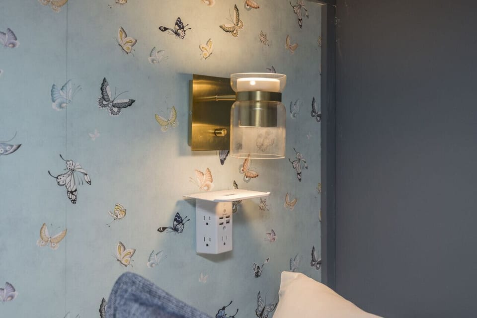 Bedroom 1. All beds are full queens with wide stairs leading to top bunks. 50` Smart TV in room.