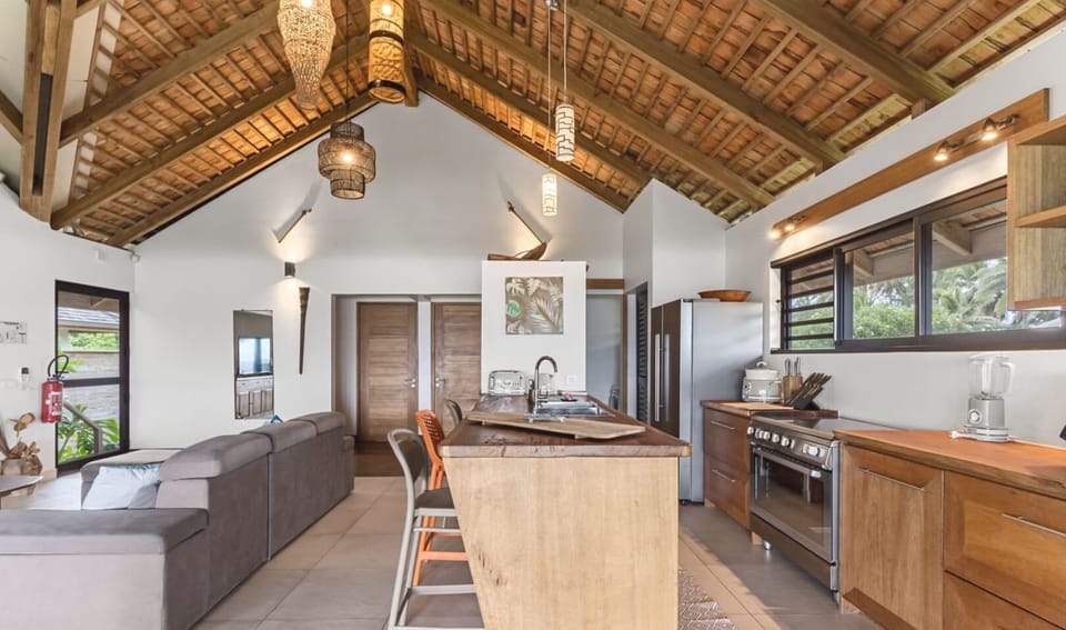 Bright kitchen with island and lounge area.