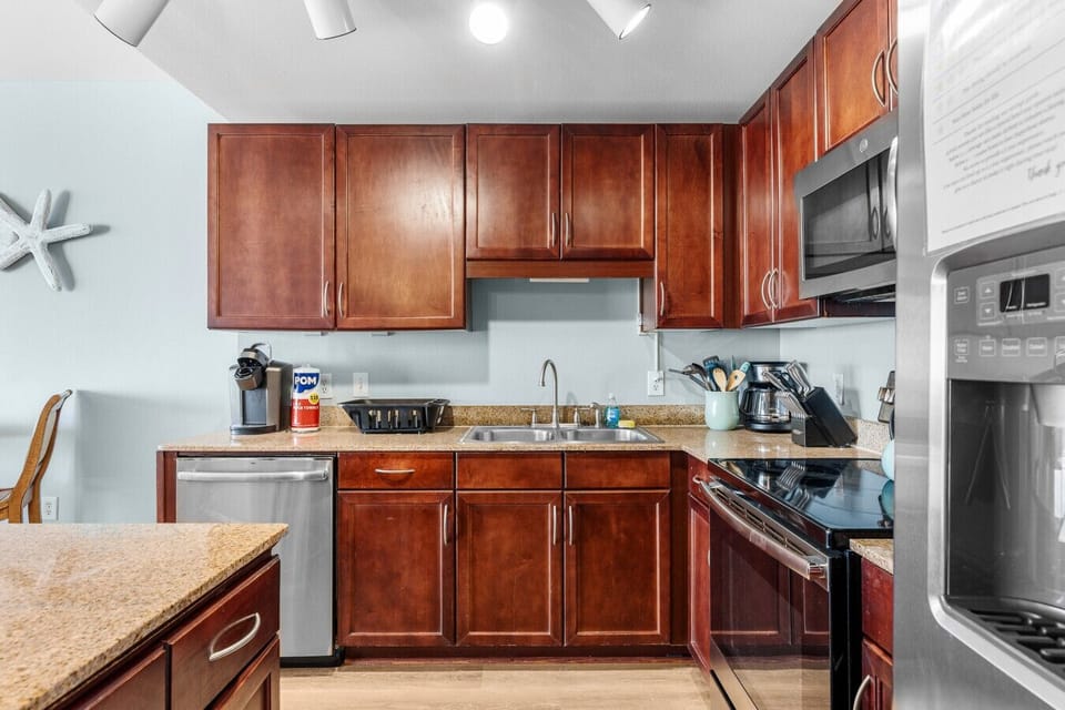 Enjoy a spacious, fully equipped kitchen with modern appliances and a large island, perfect for cooking and entertaining during your stay.