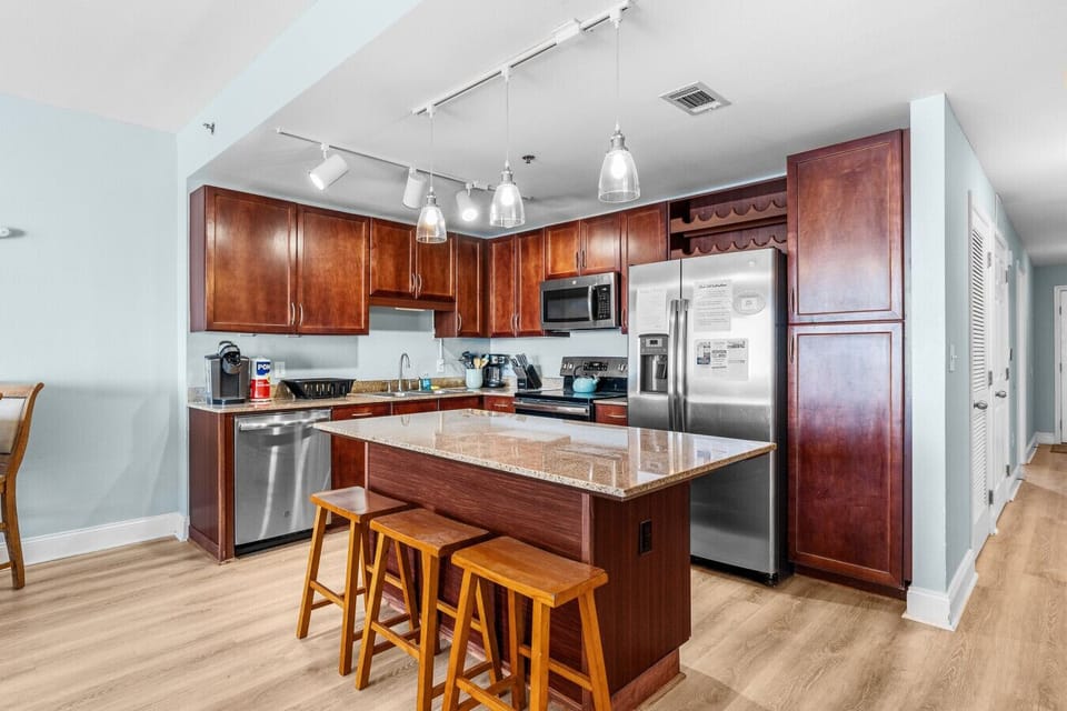 Enjoy a spacious, fully equipped kitchen with modern appliances and a large island, perfect for cooking and entertaining during your stay.