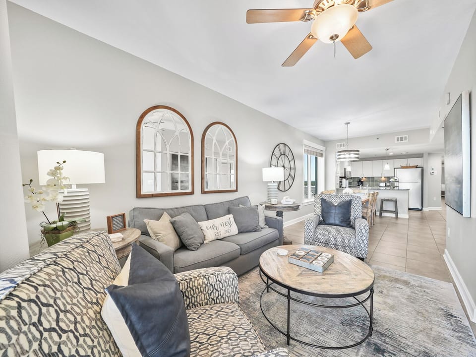 Unwind in your bright, airy living space where soft sectional seating and coastal decor create the perfect spot to relax after your adventures.