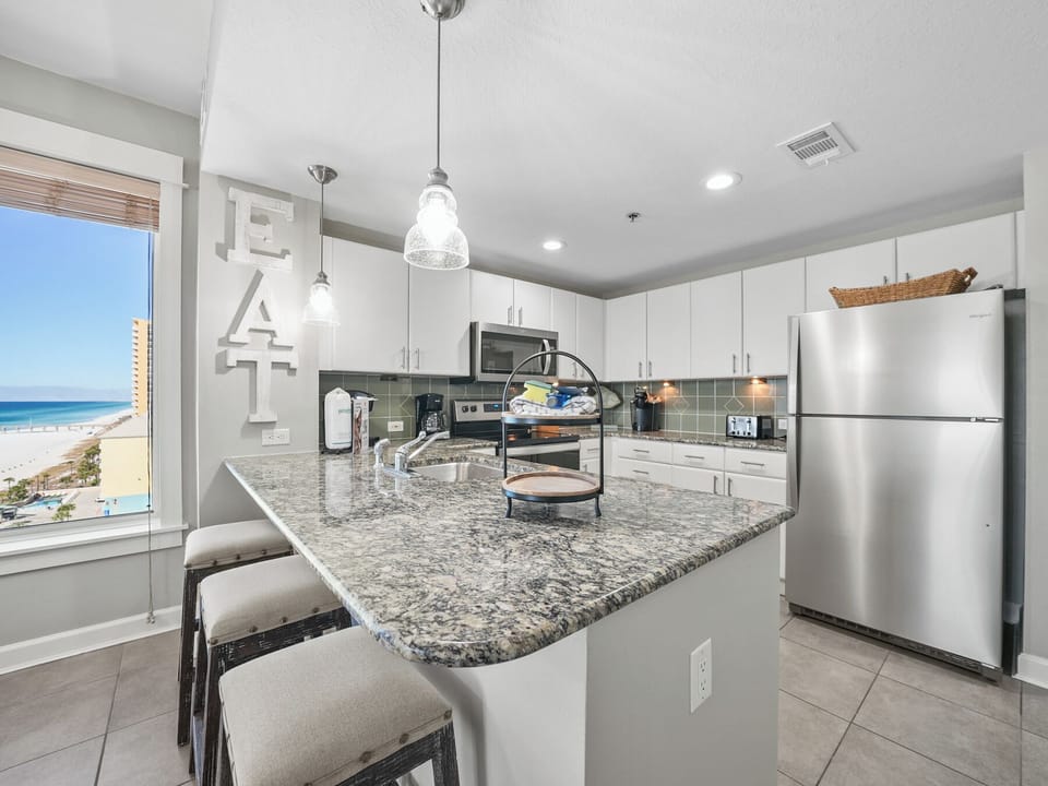 Prepare delicious meals in your modern kitchen while watching waves roll in through the window.